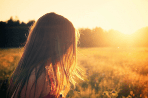 person looking into the sun 