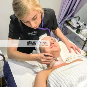 Student applying chemical skin peel to neck