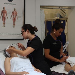 Level 2&3 Facial students in a room performing various treatments