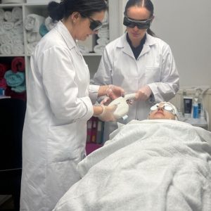 level 4 laser hair removal tutor showing laser technique to student